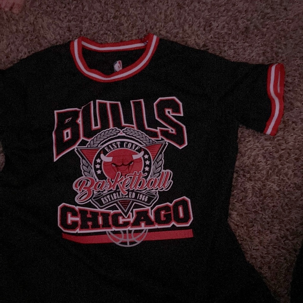 This shirt is grey and white and black it is Chicago bulls.